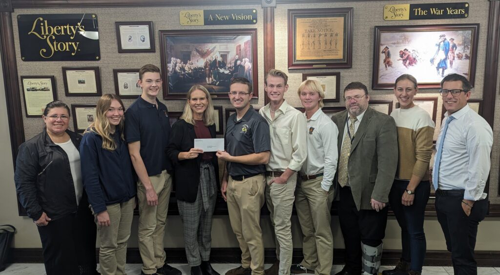 Maeser administration, faculty and students receiving grant check from representatives from the Fritz B. Burns foundation